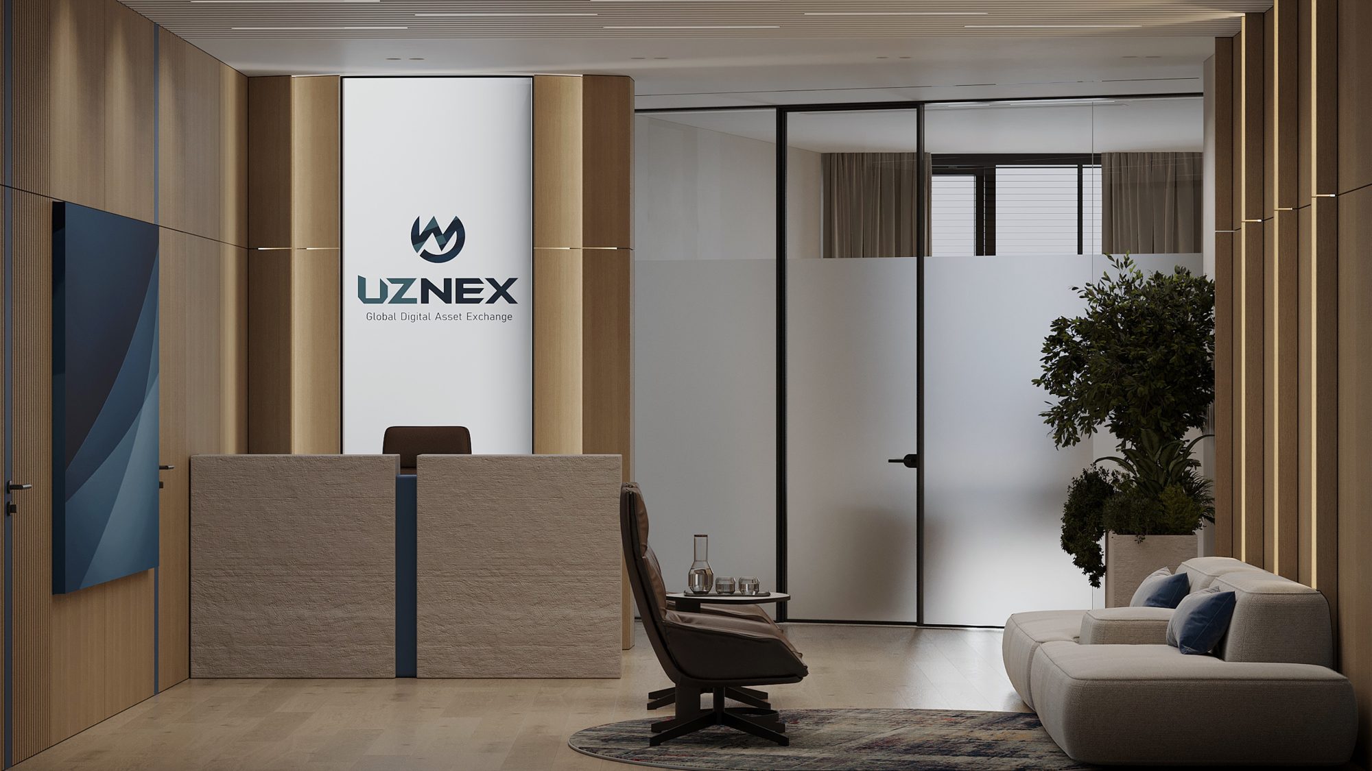 A glass walled corridor with a lounge area visible through the partitions, furnished with a sofa and a floor lamp.
